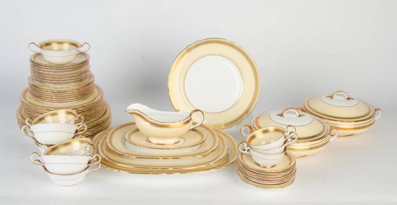 Aynsley cream & gilt English porcelain dinner set. Complete set for six with spares (originally a set for eight) including meat platters (3), pair of tureens, gravy boat & saucer. 46 pieces. 