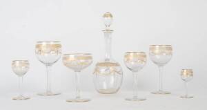 A suite of etched & gilt glass drink ware including decanters, wine, champagne, port, sherry & liqueur glasses, etc. 62+ pieces.&nbsp;