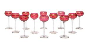 Set of 12 ornate ruby & gilt decorated wine glasses.