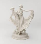 Porcelain figural group of two dancing young girls designed by &nbsp;Claire Volkhart, GermanFactory mark to base Schwarz Burger Werkstatte