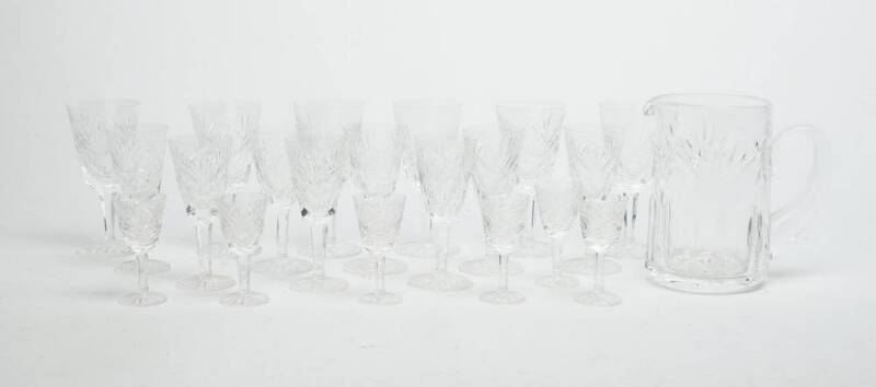 A suite of Waterford crystal drink ware including water jug, wine glasses (6), sherry glasses (6), liqueur glasses (6). 21 pieces. 