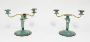 A pair of WMF patinated brass Art Deco three branch candlesticks, Austrian, c1920. 20cm