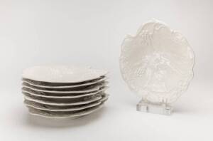 A set of eight white English porcelain grape patterned plates. 21cm diameter.