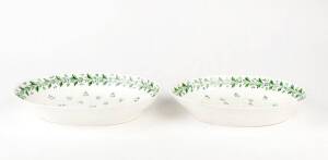 A pair of Derby porcelain ovoid dishes, English early 19th Century, decorated with corn flower sprigs, 27cm wide