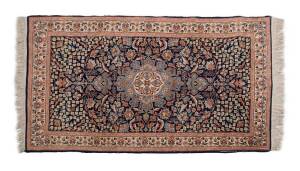 Hand woven woollen carpet, Pakistan, 20th Century. 172 x 95 cm
