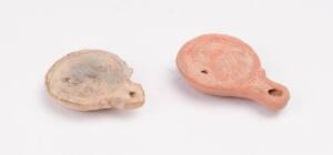 Two ancient oil lamps, 1st to 3rd Century. Approximately 10cm each