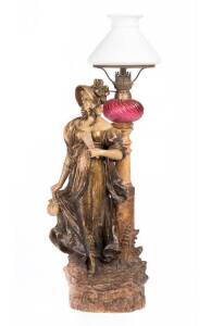 Austrian (Bohemian) pottery figured oil lamp with ruby glass font, circa 1900. 66cm