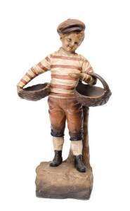 Austrian pottery figured lamp base of a young boy in football costume, early 20th Century. 42cm