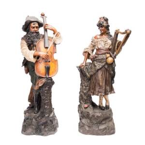 Pair of Austrian pottery figures of gypsy minstrels, circa 1900. Tallest 66cm