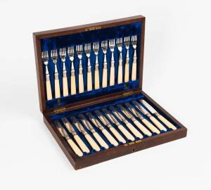Fruit cutlery setting for 12 with ivory handles in plush fitted walnut box, early 20th Century.