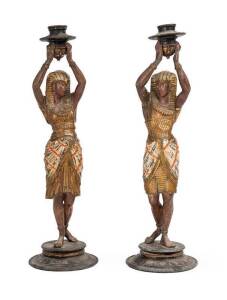 Pair of figured candle sticks in the Eygptian style, cold painted spelter, early 20th Century. 39cm