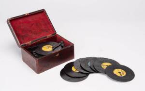 Clockwork music box in Japanese red lacquered case with 8 "Thorens" discs. Mid 20th&nbsp;Century. 9cm high, 18cm wide, 13cm deep