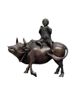 Chinese bronze censor, Qing Dynasty, 19th century,&nbsp;in the form of a buffalo,&nbsp;the rider serving as a cover.&nbsp;27cm high, 28.5cm long