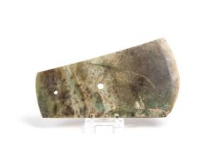 A large Chinese stone axe head, two holes drilled through, old cracks and surface wear, 20th century, 34cm long