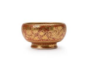 A Japanese porcelain bowl with gold lacquer decorated on a red enamel ground at the exterior and underglaze blue and white at the interior,&nbsp;&nbsp;the underglaze blue six-characters mark on the base. 20th Century. Depth 13cm, height 8cm&nbsp;
