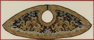 A lady's Chaopao 'piling' collar, late Qing Dynasty, circa 1875,&nbsp;from a lady's formal or state robe, framed with a pair of dragon's in gold thread above waves.&nbsp;83cm wide.*For a complete lady's Chaopao in the Metropolitan Musuem of Art (accession number: 3
