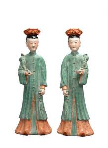 A pair of Chinese polychrome ladies, Peoples' Republic, 20th century,&nbsp;each one very finely modelled holding a sceptre in one hand,&nbsp;the flat base with a russet burn.&nbsp;42.5cm&nbsp;