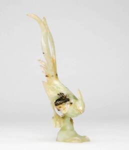 Chinese pale green stone carving of a pheasant perched on a rock, Republic period. &nbsp;24.5cm high.