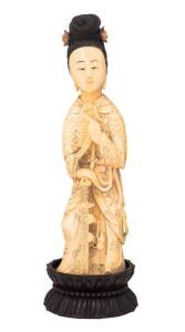 Chinese carved ivory figure on carved wooden stand, early 20th Century. Ivory height 21cm