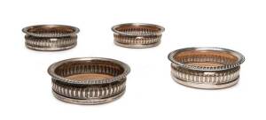 Set of four Sheffield plate wine coasters, 19th century. Diameter 16cm.