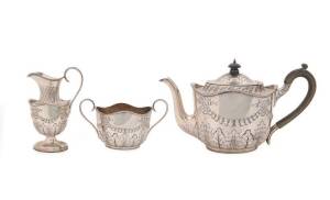 Sterling silver three piece tea service by John & William Deakin, Sheffield, circa 1902.