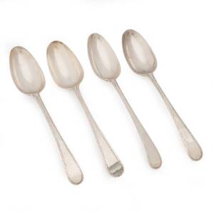 HESTER BATEMAN: A fine set of four feathered edged sterling silver table spoons, London.