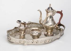 English silver plated three piece tea service & shaped tray with pierced gallery. (4 items)
