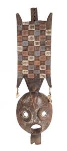 Carved African tribal mask with shell decoration. Early 20th Century. 71cm.