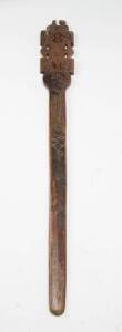 A Gugu war club Tonga. Flat form shaped club with intricate incised decoration on one side, 85 cm