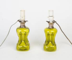 A pair of sterling silver mounted green glass table lamp bases, 20th century. 30cm.&nbsp;