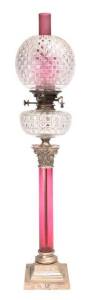 BANQUET LAMP: Hobnail cut crystal font & shade with ruby glass chimney & base, silver plated Corinthian capital & plinth. All original including silver plated single black button burner, 19th Century. 92cm.