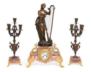 French figured spelter antique mantle clock on rouge marble base with candelabra garnitures. 63cm