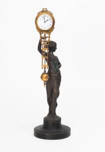Mystery clock, early 20th Century with figured base. 39cm