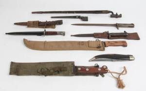 BAYONETS: Range including 1860's socket bayonet, to U.S. Army (WWII), plus a fine Khukuri knife & a Gibraltar sailors knife. (10 items)