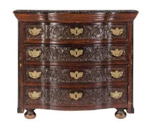 An antique Continental walnut 4 drawer chest. Impressive floral carved drawer fronts and edge with brass swing handles. 96cm x 65cm x 85cm.