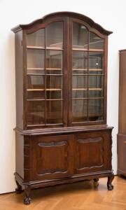 BOOKCASE: Continental dome topped walnut bookcase, c1930s. Height 203cm, width 113cm, depth 43cm
