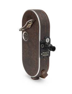 BELL & HOWELL (USA): Filmo Field Model 16mm movie camera with patterned leather finish. An attractive and unusual camera in fine condition.