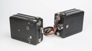 DEVRY CORPORATION (USA): Devry Standard ("The Lunch Box") 35mm movie cameras - two examples, each with winder, one with carry strap.