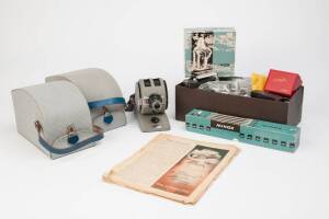 MINOX (Germany): A large group of Minox accessories and literature. The group with three Minox projectors, a boxed copying stand , boxed developing kit, and Minox camera and flash cases and holders. Books include "Minox Guide", two editions of "The Minox 