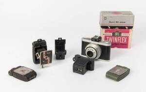 UNIVERSAL CAMERA CORPORATION (USA): A varied group of Universal Camera Company products. The group with boxed Univex Iris, boxed Twinflex with instruction manual, Meteor with instruction manual, Univex AF, AF2 and AF4, Univex Model A (two variations) and 
