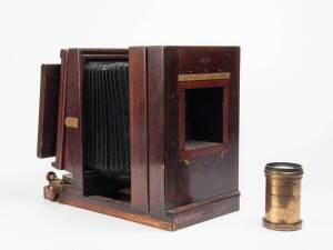 Kodak Ltd., Kingsway, London. Studio Camera No. 1, 6 1/2 x 8 1/2" plate camera of wood and brass construction complete with studio stand and J.H. Dallmeyer lens; various focussing backs, etc. Main Mounting lens board is missing; generally in good conditio