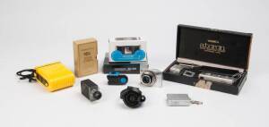 A group of miniature cameras. The group with some novelty 110 and digital cameras including an unused digital Harinezumi 2 with case. Additionally, a nice group of subminiatures including a Brinkert EFBE and a Tynar. (11 cameras)