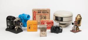 Balance of collection - photographic equipment / accessories. Three boxes of photographic items with vintage projectors, Zeiss scientific camera, metal developing tank, Robot security camera, a small group of Hasselblad accessories, Exakta bellows and num
