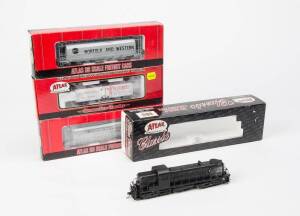 ATLAS: Alco RSC-2 locomotive plus rolling stock comprising a 6 Bay Cylindrical Hopper (N & W), 36' Wood Reefer Car (Pluto Water) & 6 Bay Cylindrical Hopper (Great Northern). Mainly NIB. (4 items)