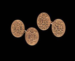 A pair of gold cufflinks, oval with floral decoration, 15ct rose gold, weight 9.1 grams, (Hallmarks not matched).