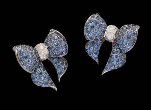 A pair of sapphire and diamond bow earrings, pave set. 18ct white gold, post and clip attachments, width 2.3cm.