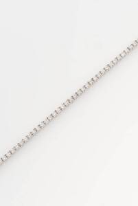 A diamond line bracelet, claw set with seventy- two diamonds of total weight 3.05 carats, length 18cm.&nbsp;