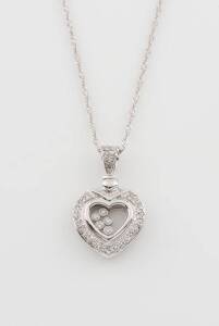 A diamond pendant on chain, the heart shaped pendant set with floating diamonds, 18ct white gold.&nbsp;