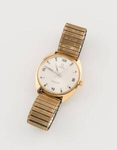 A Gentleman's gold capped Omega Seamaster Cosmic wristwatch, automatic, silvered dial, applied silver baton and painted Roman numerals, non-original expandable bracelet, 35mm.