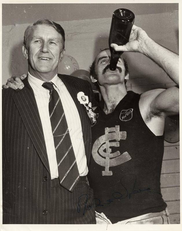 MALCOLM FRASER (22nd Prime Minister of Australia), signature on photograph of Malcolm Fraser & Alex Jesaulenko celebrating a Carlton victory.